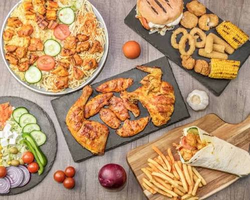 A Cluckster feast of burgers, fries and sides.