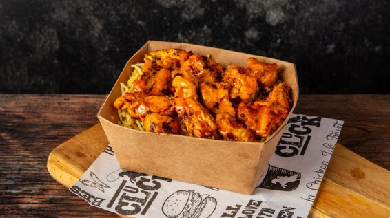 Chicken wings, chips and dip.